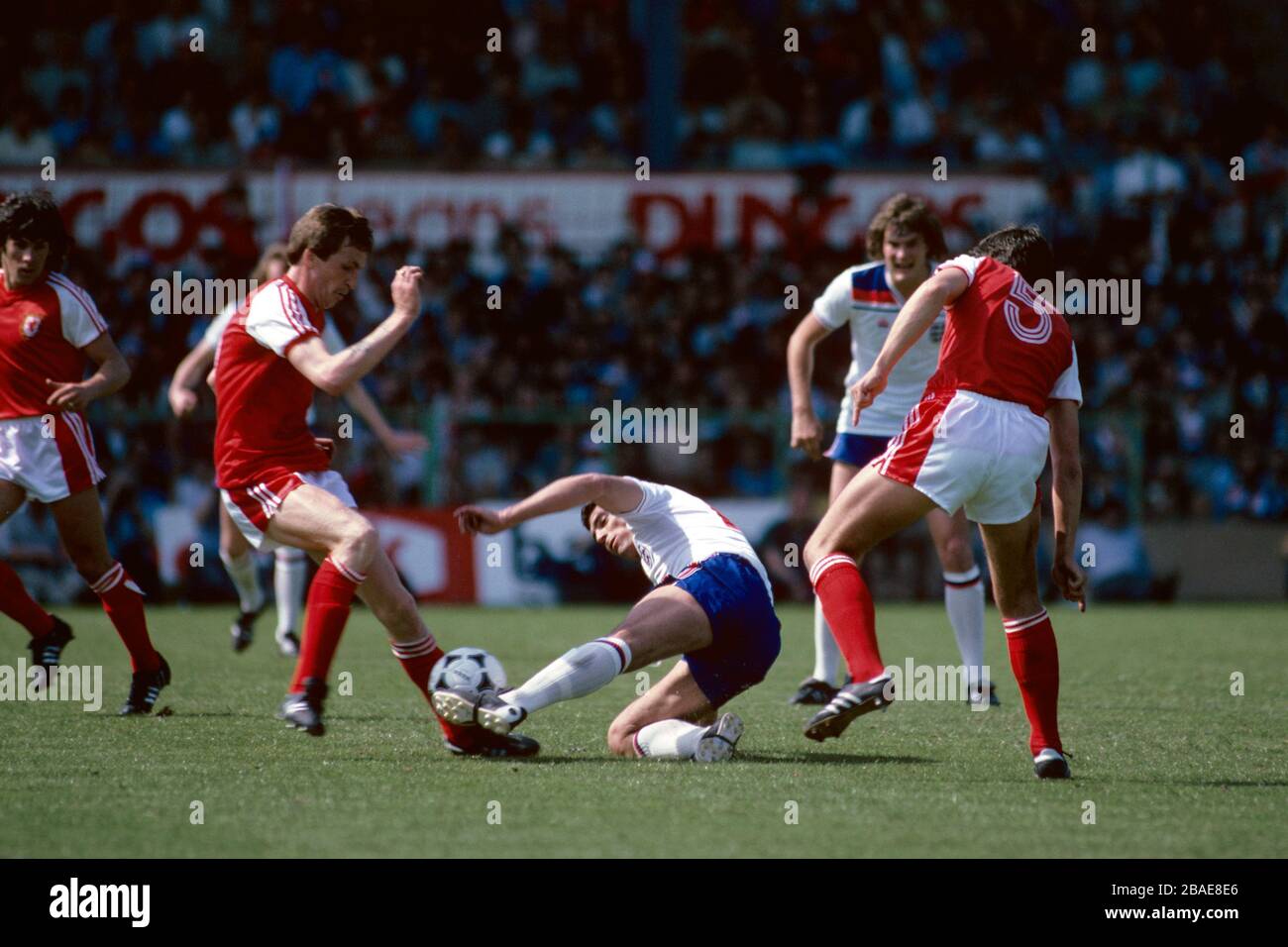England's Trevor Brooking (c) battles for the ball with Wales's Joey Jones (l) Stock Photo