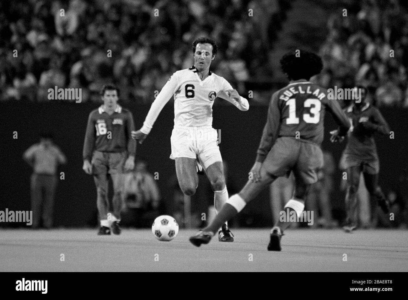 Franz Beckenbauer, New York Cosmos takes the ball past Leonardo Cuellar, NASL All Stars Stock Photo