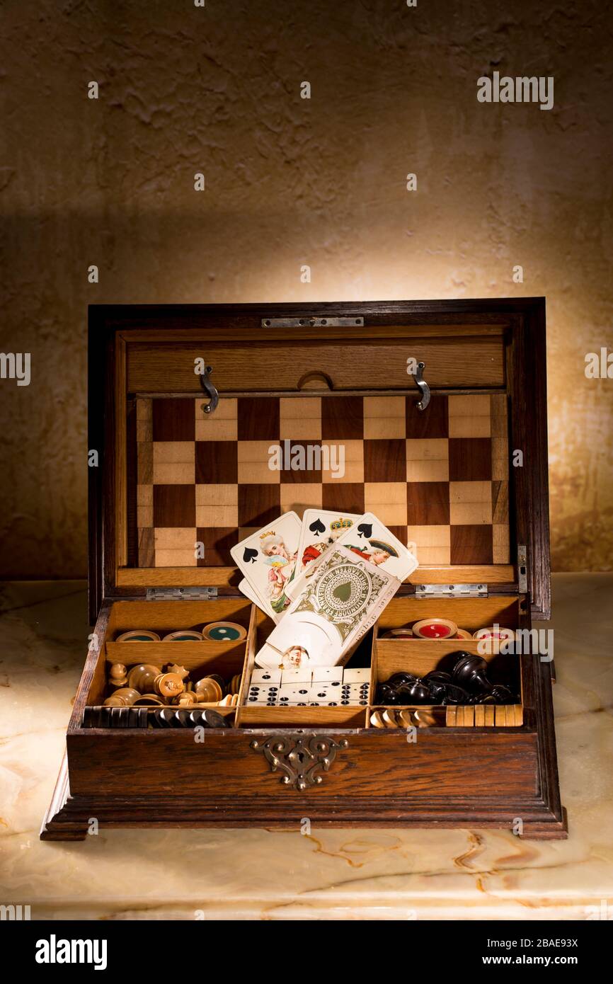 Box with antique board games. Stock Photo