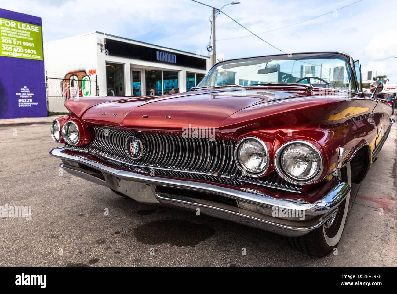 A three quarter front view of a Buick convertible car parked on a side of a road, Wynwood neighborhood, Miami Florida, USA. Stock Photo