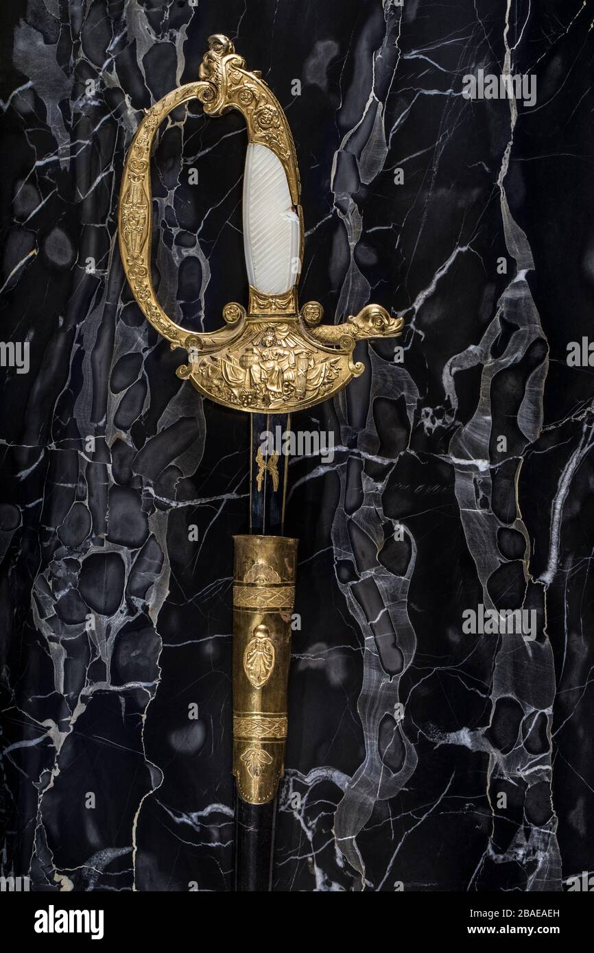 French officer court sword (shortsword) an black marble background.The 19th century. France. Stock Photo