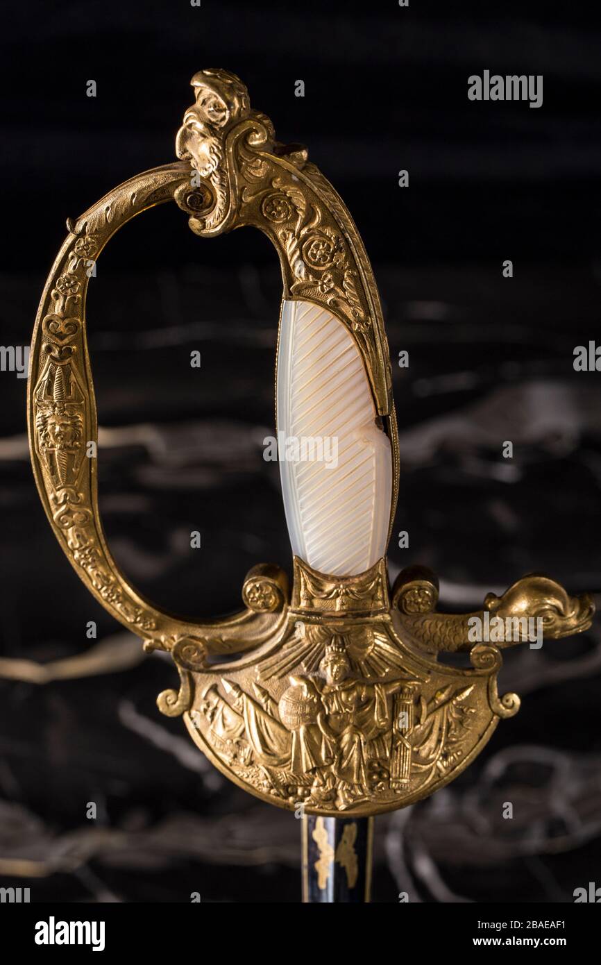 Hilt of French officer court sword (shortsword) an black marble background.The 19th century. France. Stock Photo