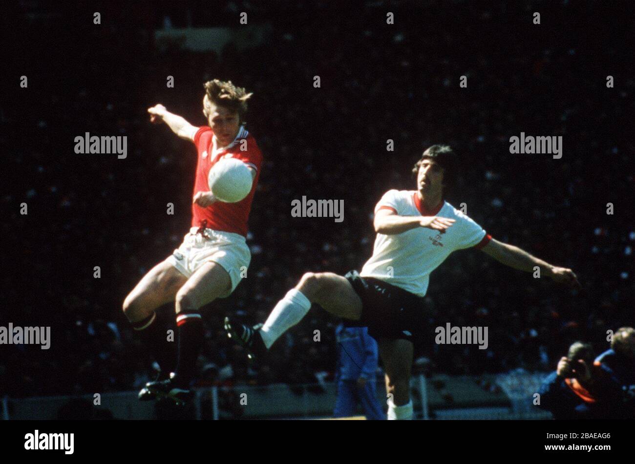 Brian Greenhoff, Manchester United, beats David Johnson, Liverpool Stock Photo