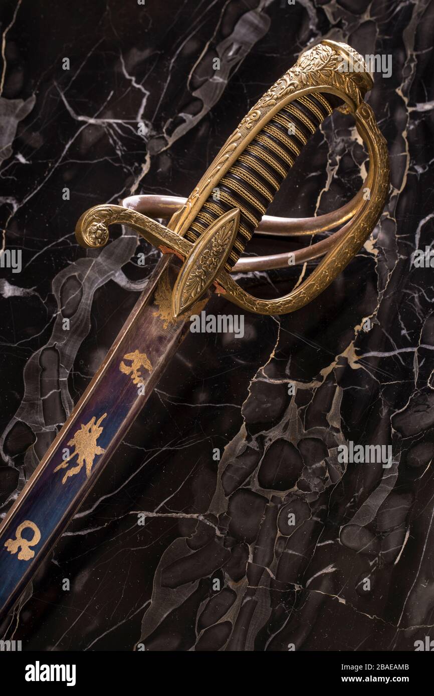 French officer saber (sabre) an black marble background.The 19th century. France. Stock Photo