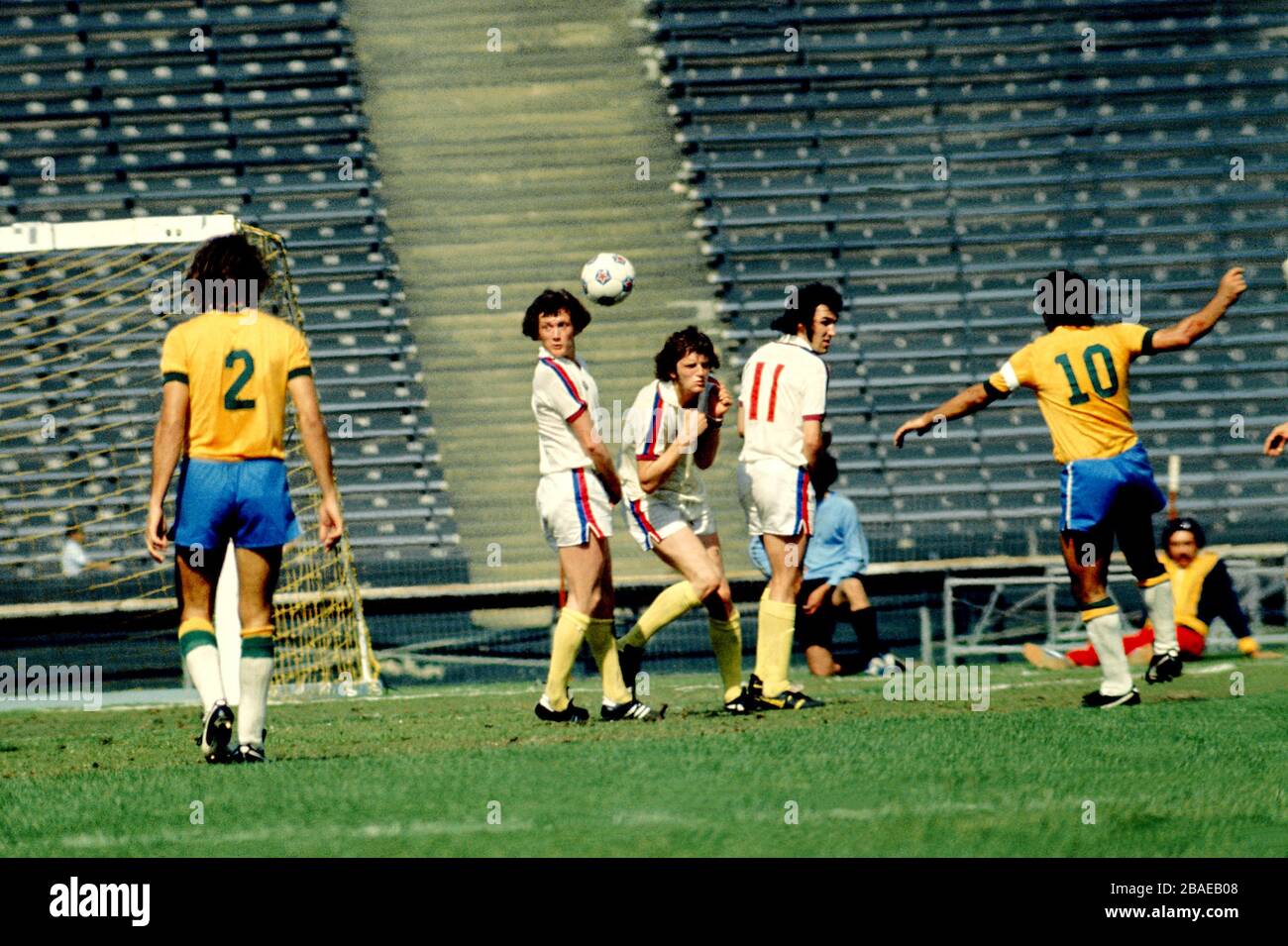 (L-R) The England wall of Trevor Cherry, Mick Channon and Gerry Francis flinch away from Brazil's Roberto Rivelino's free kick Stock Photo