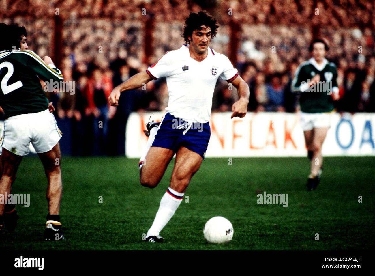 Bob Latchford of England (r) goes past Ireland's Paddy Mulligan (l) Stock Photo