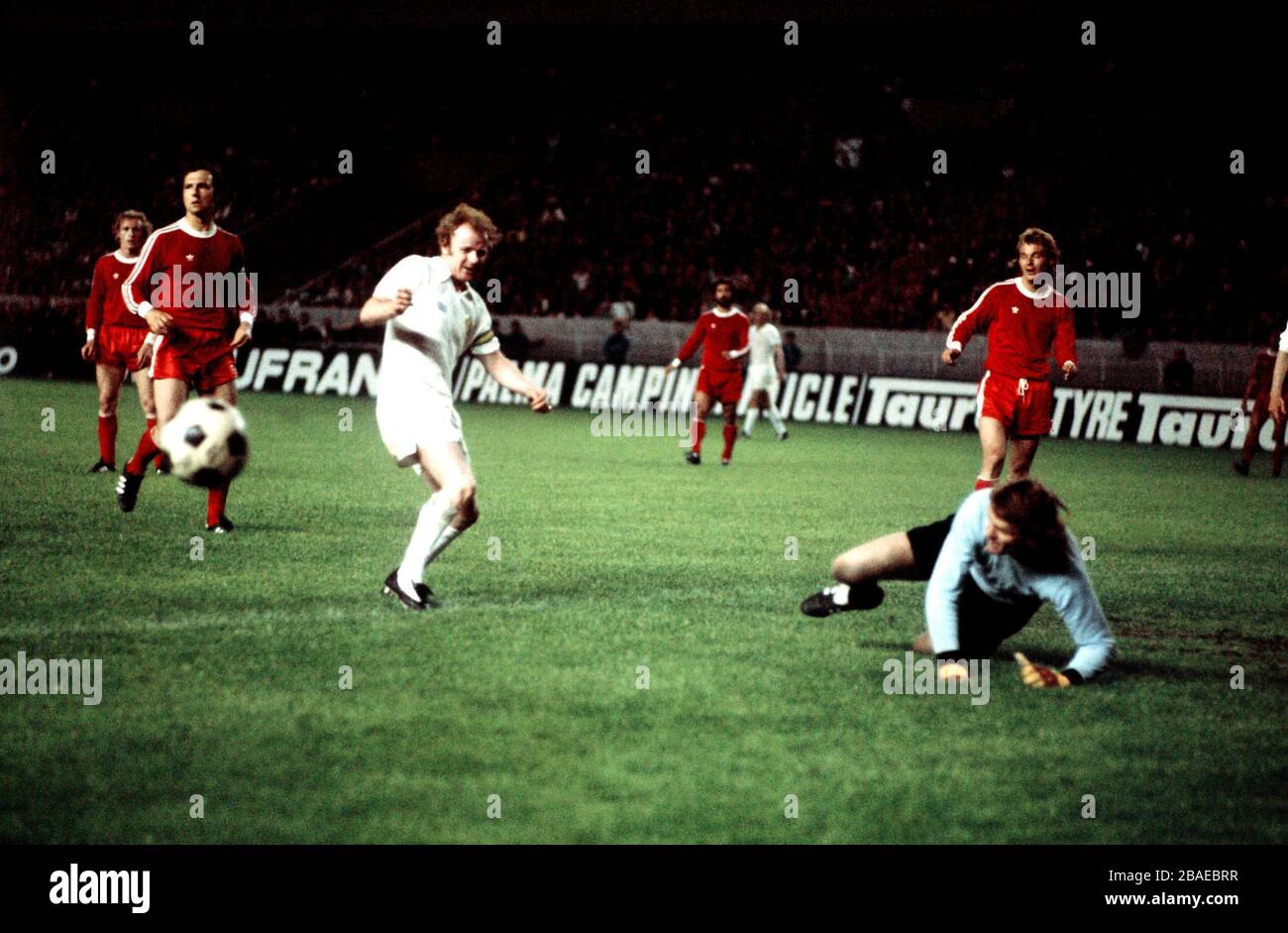 Bayern Munich goalkeeper Sepp Maier (r) saves from Leeds United's Billy Bremner (l) Stock Photo