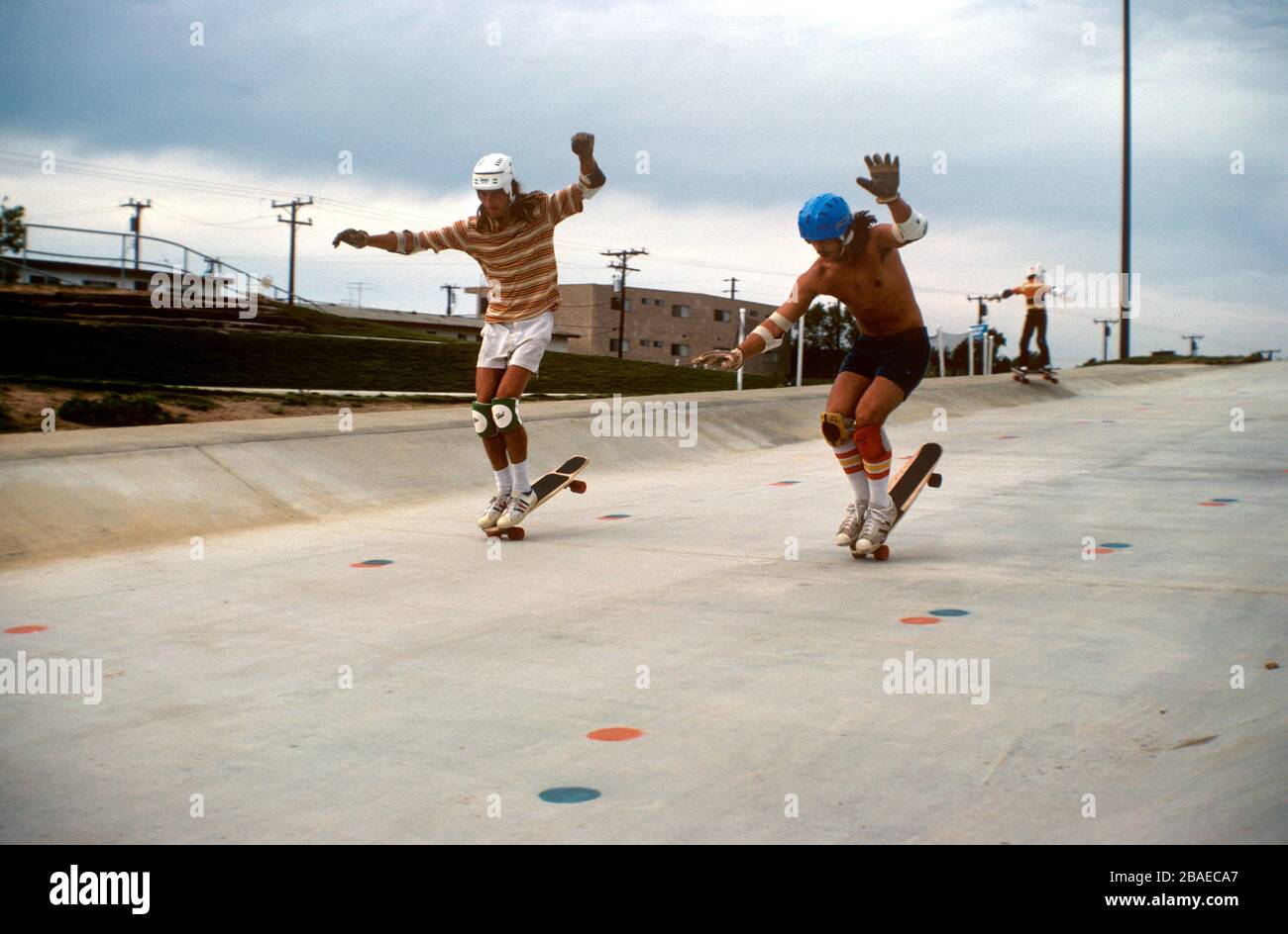 Synchronized skateboarding action. Stock Photo
