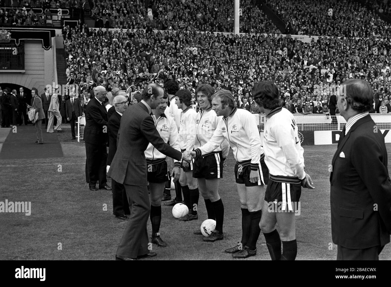 Fulham's Bobby Moore (second r) shakes hands with HRH The Duke of Kent (l) as captain Alan Mullery (second l) introduces his team before the match Stock Photo