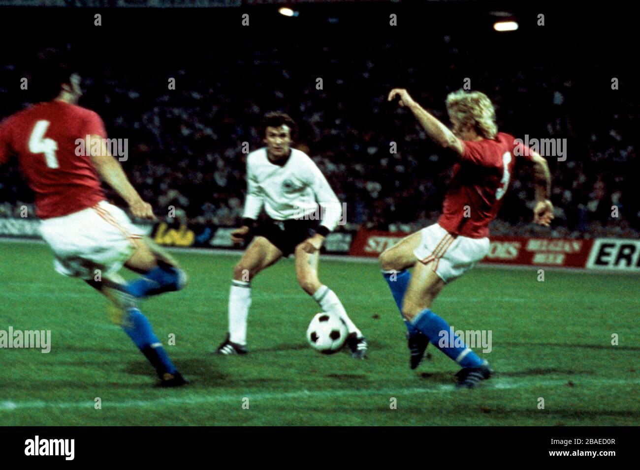 Czechoslovakia 's Anton Ondrus (l) and Jan Capkovic (r) with West Germany's Dieter Muller (c) Stock Photo