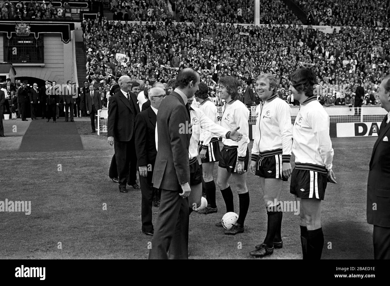 Fulham's Bobby Moore (second r) jokes with HRH The Duke of Kent (l) as captain Alan Mullery (l, half hidden) introduces his team before the match Stock Photo