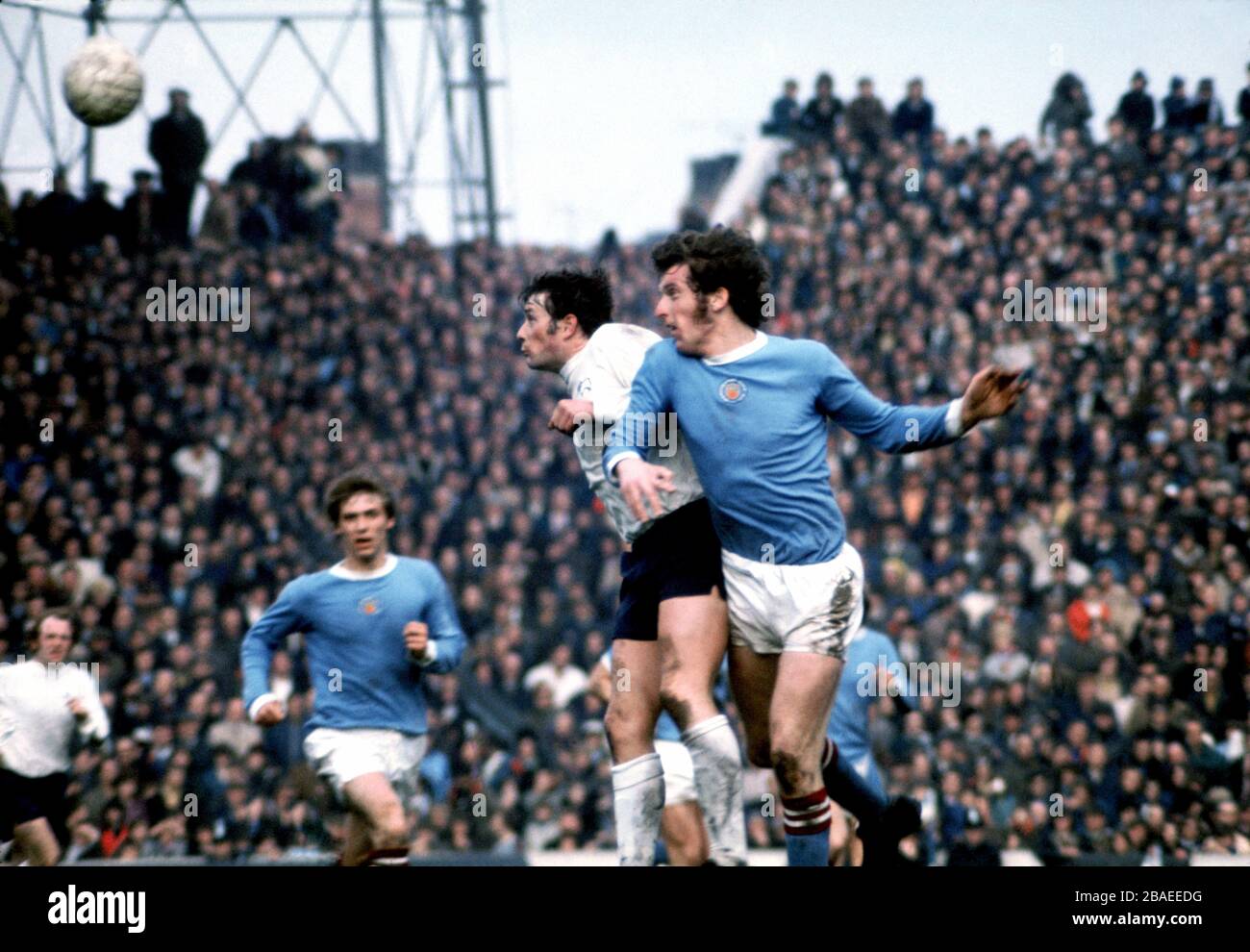 Manchester City's Tommy Booth challenges  Derby County's John O'Hare Stock Photo