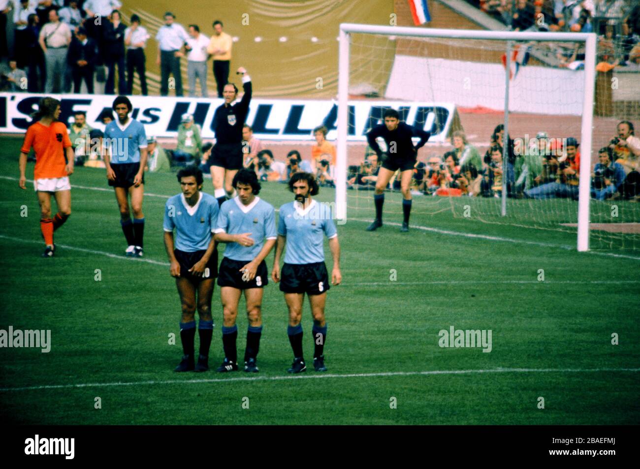 The Uruguay wall (l-r), Pedro Rocha, Victor Esparrago and Ricardo Pavoni, defend a free kick, watched by goalkeeper Ladislao Mazurkiewicz (r) Stock Photo