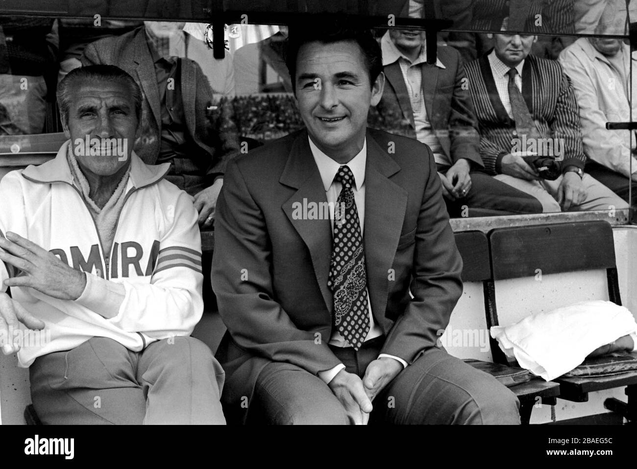 Leeds United manager Brian Clough (r) and trainer Jimmy Gordon (l) sit in the dugout early in the season. They stayed at Elland Road for just 44 days Stock Photo