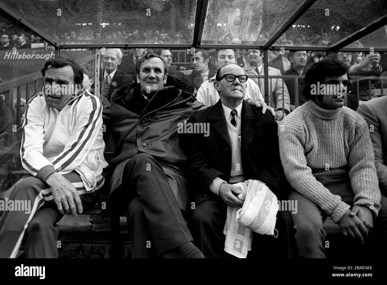 Leeds United's trainer Les Cocker (l), manager Don Revie (second l) and Mick Bates (r) look relaxed as Leeds cruise to a 3-0 victory Stock Photo