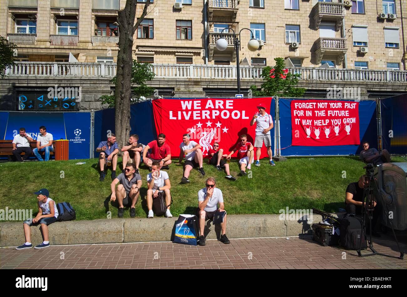 Kyiv, Ukraine - May, 2018: Liverpool fans lying on the grass in official fan zone in Kiev city center on Khreshchatyk street before Champions League F Stock Photo