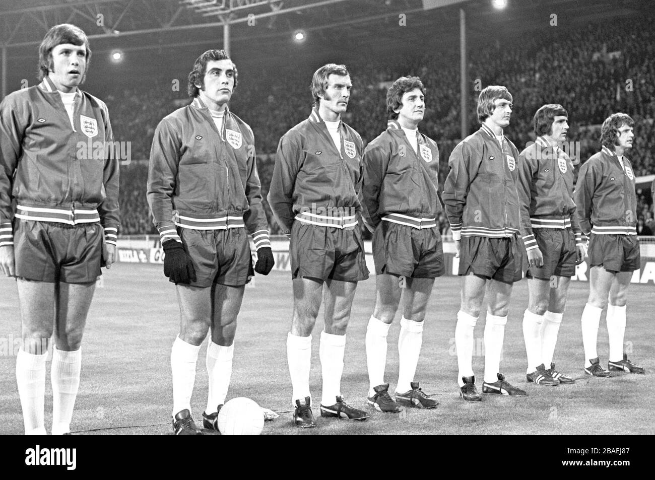 The England players line up for the national anthem before their vital World Cup Qualifier: (l-r) captain Martin Peters, goalkeeper Peter Shilton, Paul Madeley, Roy McFarland, Allan Clarke, Norman Hunter, Mick Channon Stock Photo