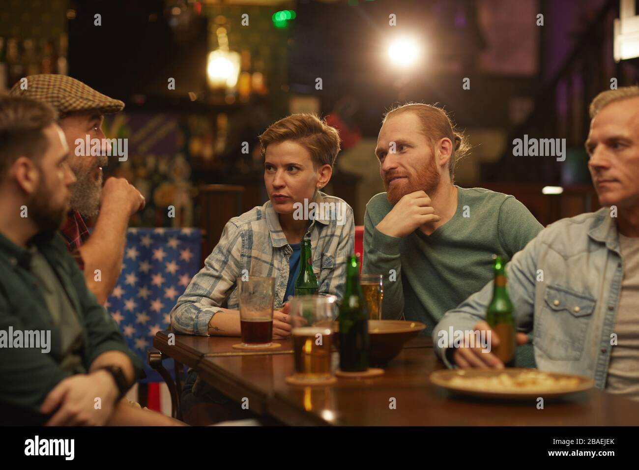 Group of friends sitting at bar hi-res stock photography and images - Alamy