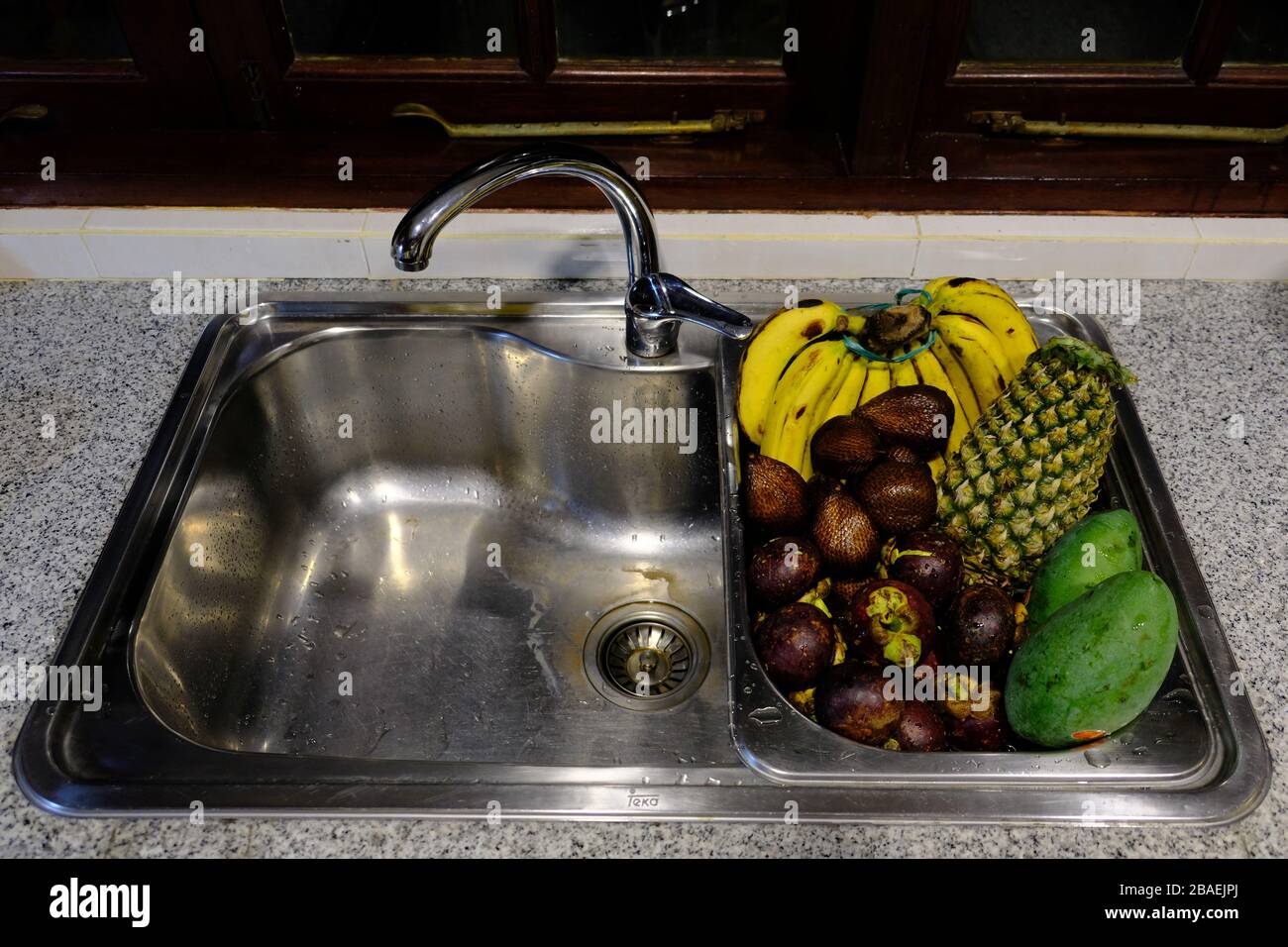 Batam Island Indonesia - local frueits in the kitchen sink Stock Photo