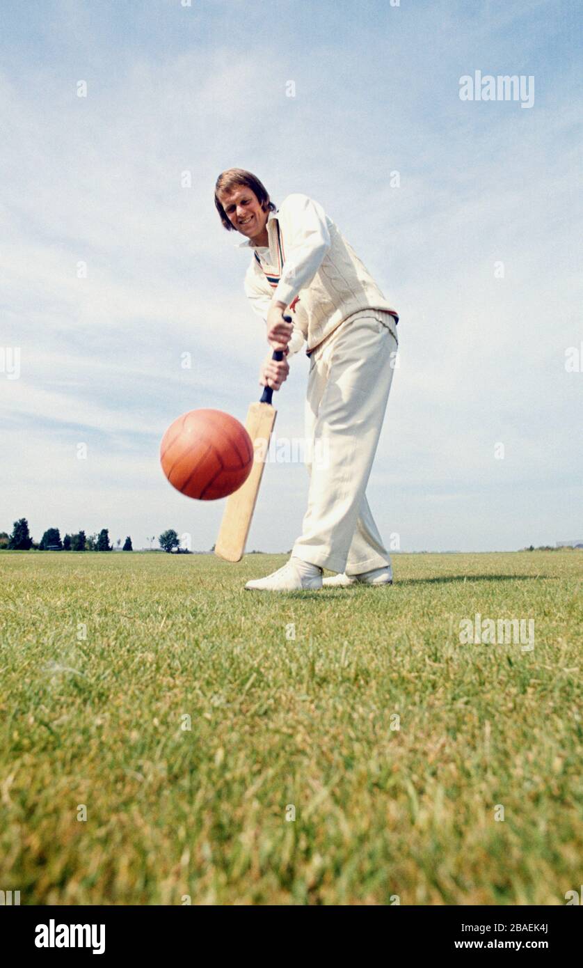 Carlisle United Footballer Chris Balderstone shows off his cricketing skills by hitting a football with a cricket bat. Chris Balderstone played cricket for Leicestershire County Cricket Club, and went on to play Cricket for England in 1976. Stock Photo