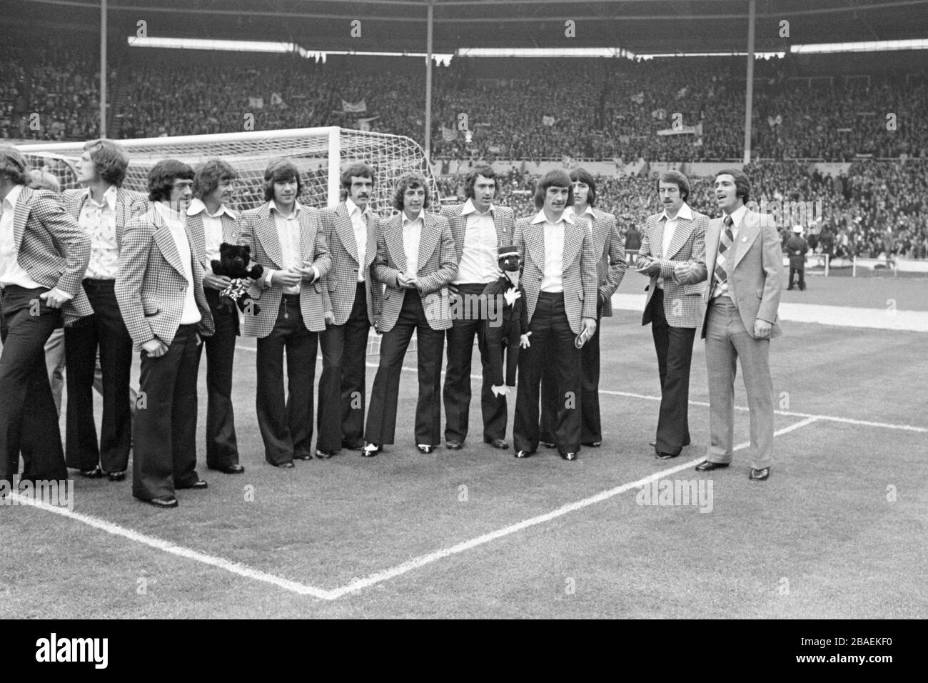 The Newcastle United team look around Wembley before the match. Pictured holding a magpie mascot is Terry McDermott. The Newcastle United team look around Wembley before the match. Pictured holding a magpie mascot is Terry McDermott. (l-r) Unknown, John Tudor, Pat Howard, Terry Hibbitt, ? Malcolm Macdonald, Iam McFaul,  Tommy Gibb, ? Tommy Cassidy, Terry McDermott, Jimmy Smith, Frank Clark and Bobby Moncur. Stock Photo