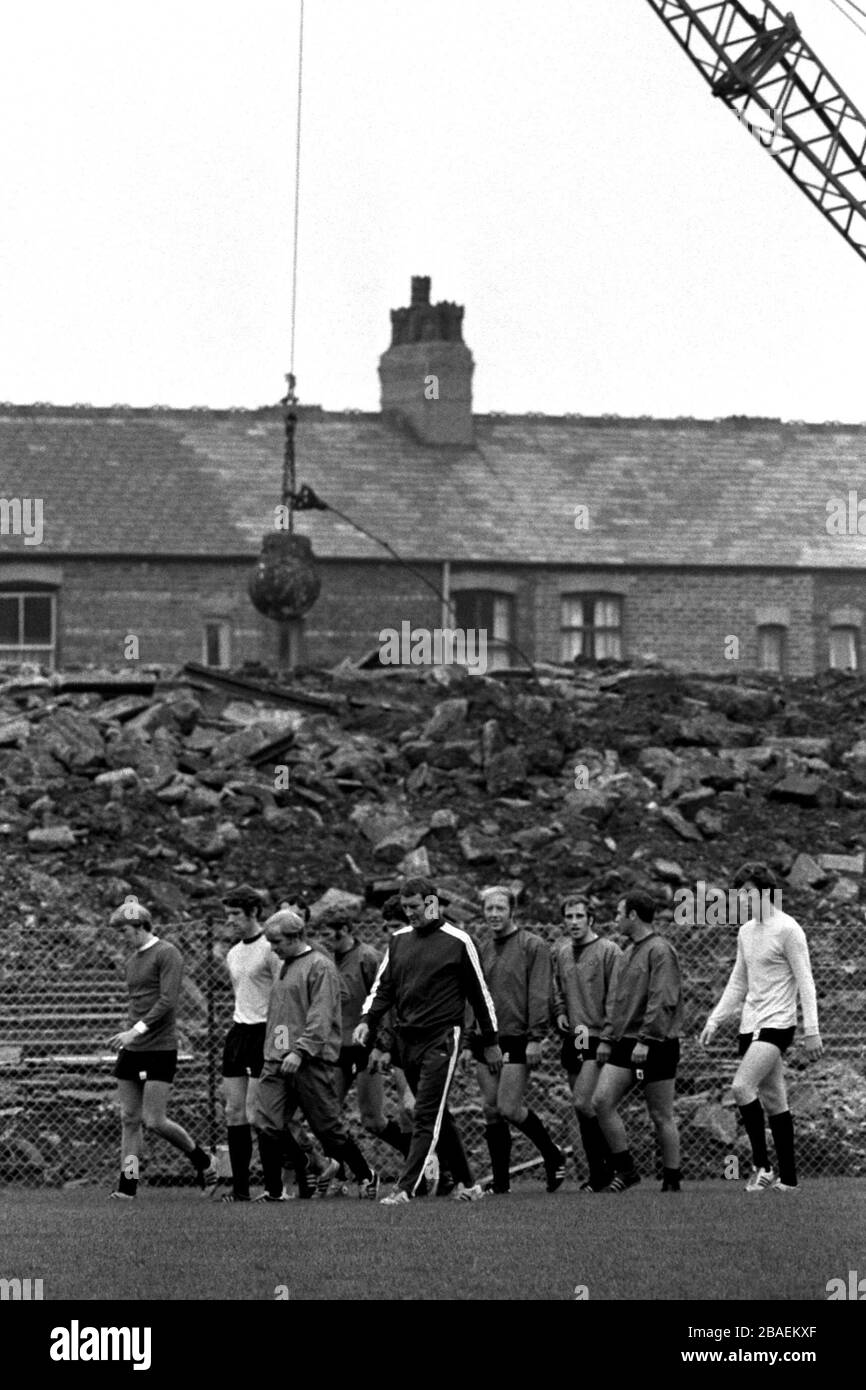 (L-R) Manchester City's Colin Bell, Mike Doyle, Francis Lee, Tony Book, coach Malcolm Allison, George Heslop, Arthur Mann, Glyn Pardoe and Tommy Booth warm up with a slow walk around Maine Road Stock Photo