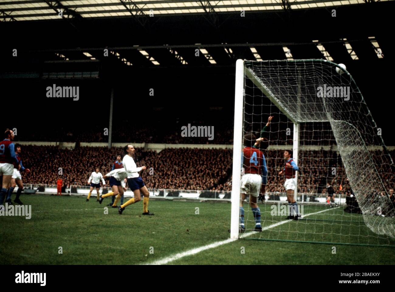 Aston Villa goalkeeper John Dunn (partly hidden) tips over a header from Tottenham Hotspur's Alan Gilzean (c) Stock Photo