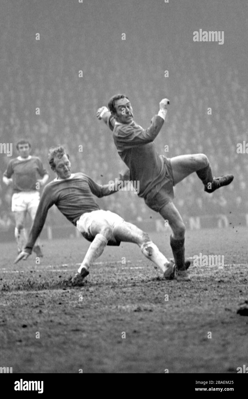 Everton's Sandy Brown (l) goes through the back of Liverpool's Ian St John (r). Stock Photo