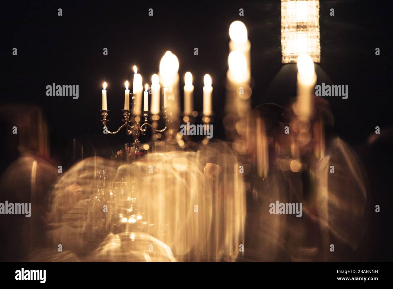 retro candlesticks with burning candles in dark room Stock Photo Alamy