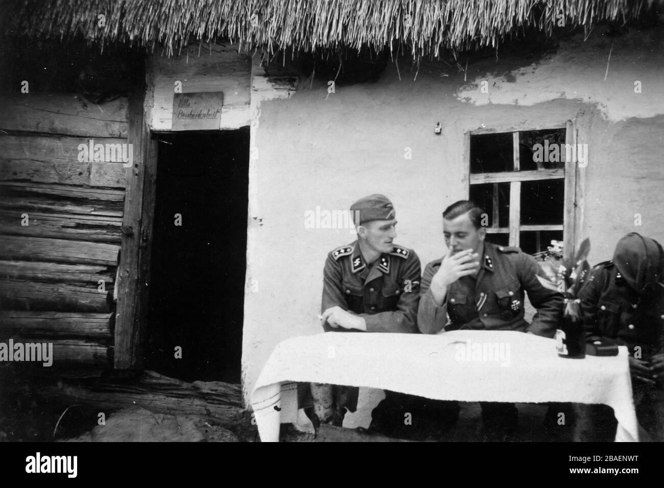 Second World War / WWII Historical photo about german invasion - Waffen SS troopers in USSR (Ukraina) - 1942 Morosowo village Battalionskommander 9 co Stock Photo