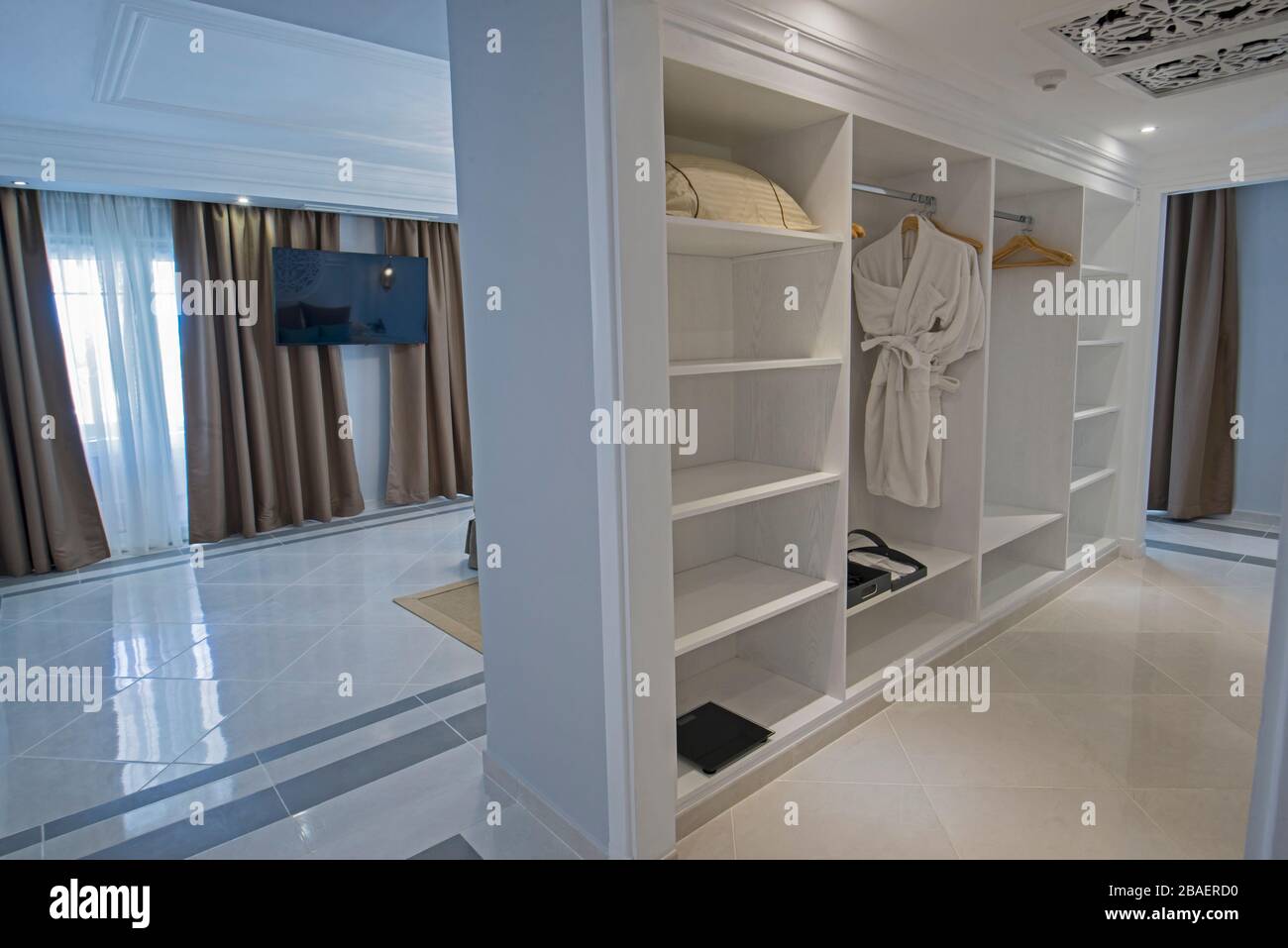 Interior of master suite luxury hotel room with walk in closet wardrobe
