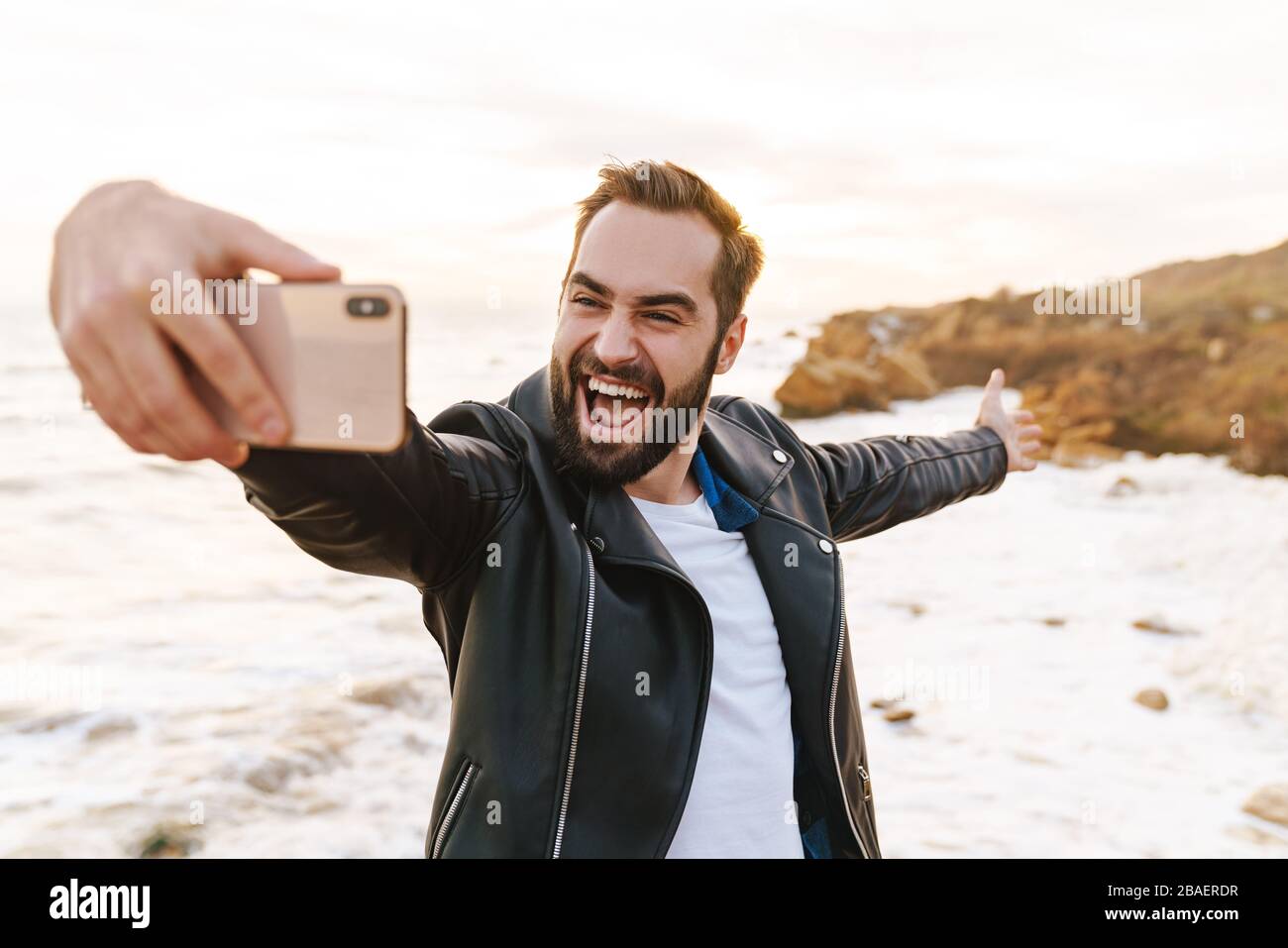 Handsome man in leather jacket hi-res stock photography and images - Alamy