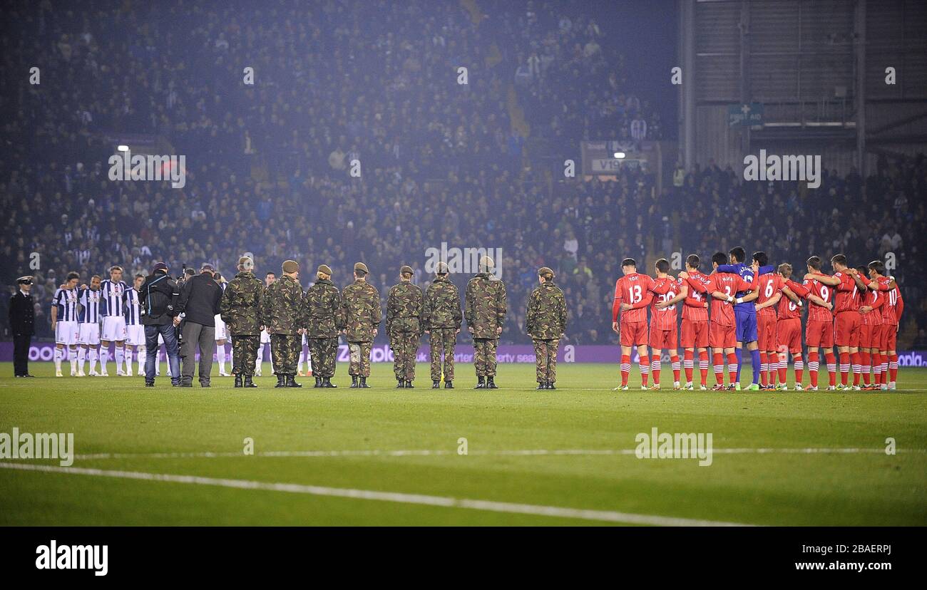 Both teams observe a minute's silence before the game Stock Photo