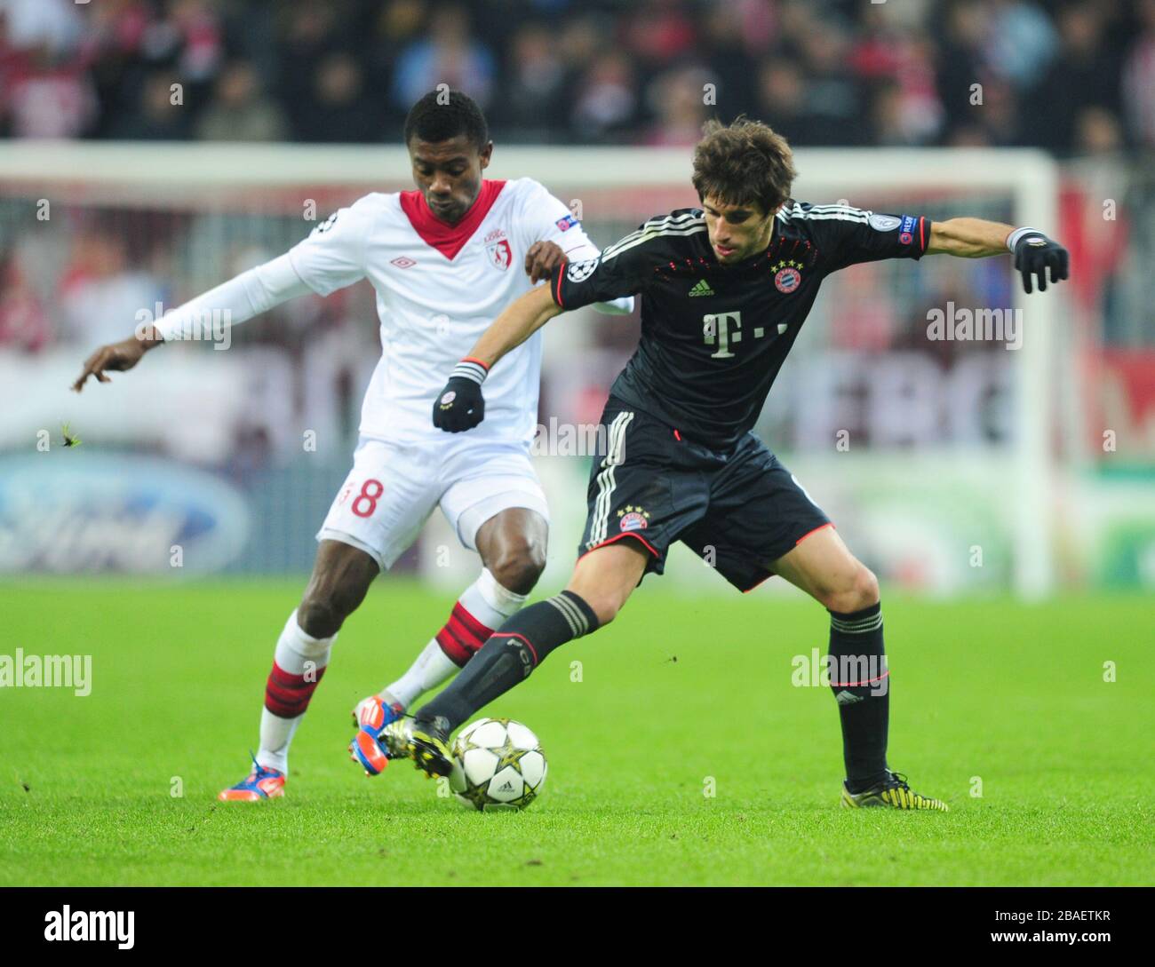 Bayern Munich's Javi Martinez and Lille's Salomon Kalou battle for the ball Stock Photo
