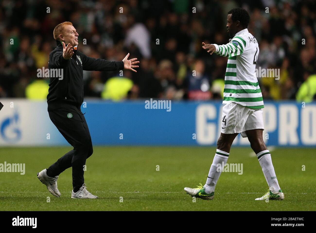 Celtic's manager Neil Lennon celebrates at the final whistle with Efe Ambrose Stock Photo