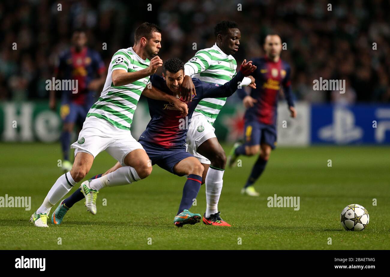 Celtic's Victor Wanyama (right) and Joe Ledley in action with Barcelona's Pedro Rodriguez Stock Photo