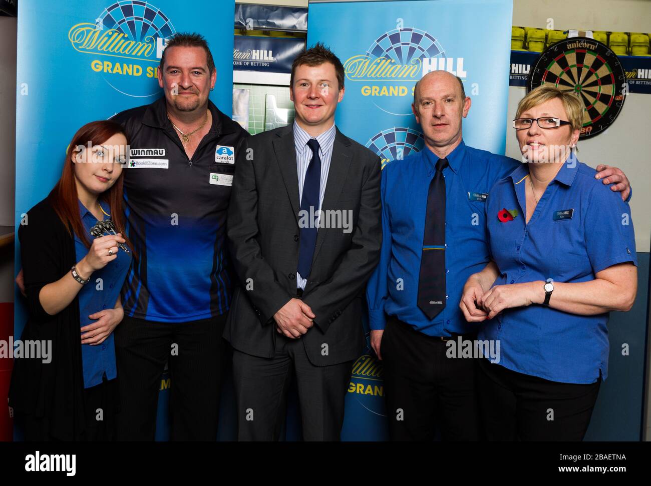 Staff from the William Hill store pose with Dean Winstanley Jo, Dean Winstanley, District Manager Pete Bowskill, Rob and  Kim at the William Hill shop in Wolverhampton Stock Photo