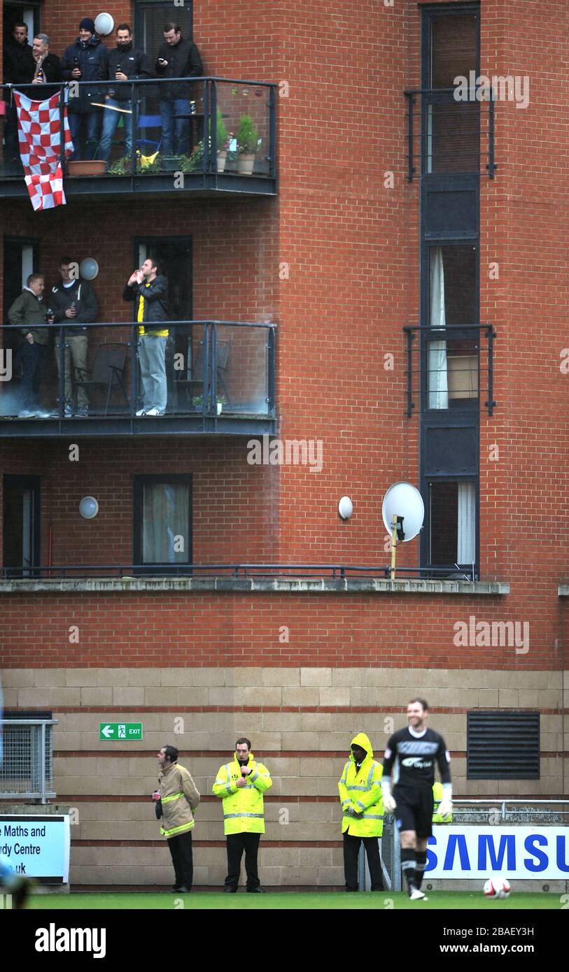 Leyton Orient fans watch the action from a unique vantage point Stock Photo