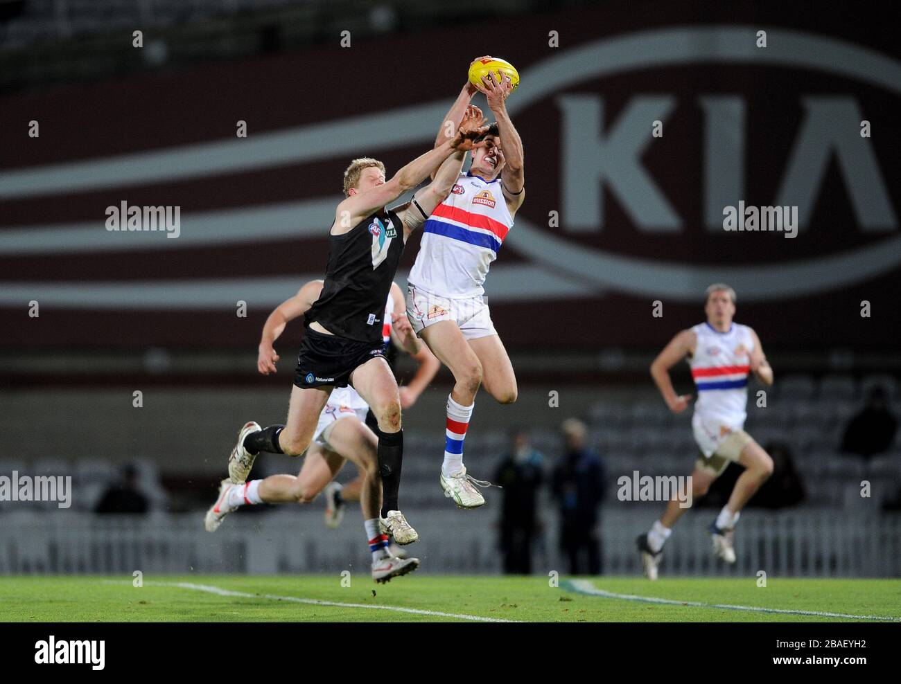 Port Adelaide (black) playing Western Bulldogs (white) in the Challenge Cup at the Kia Oval. Stock Photo