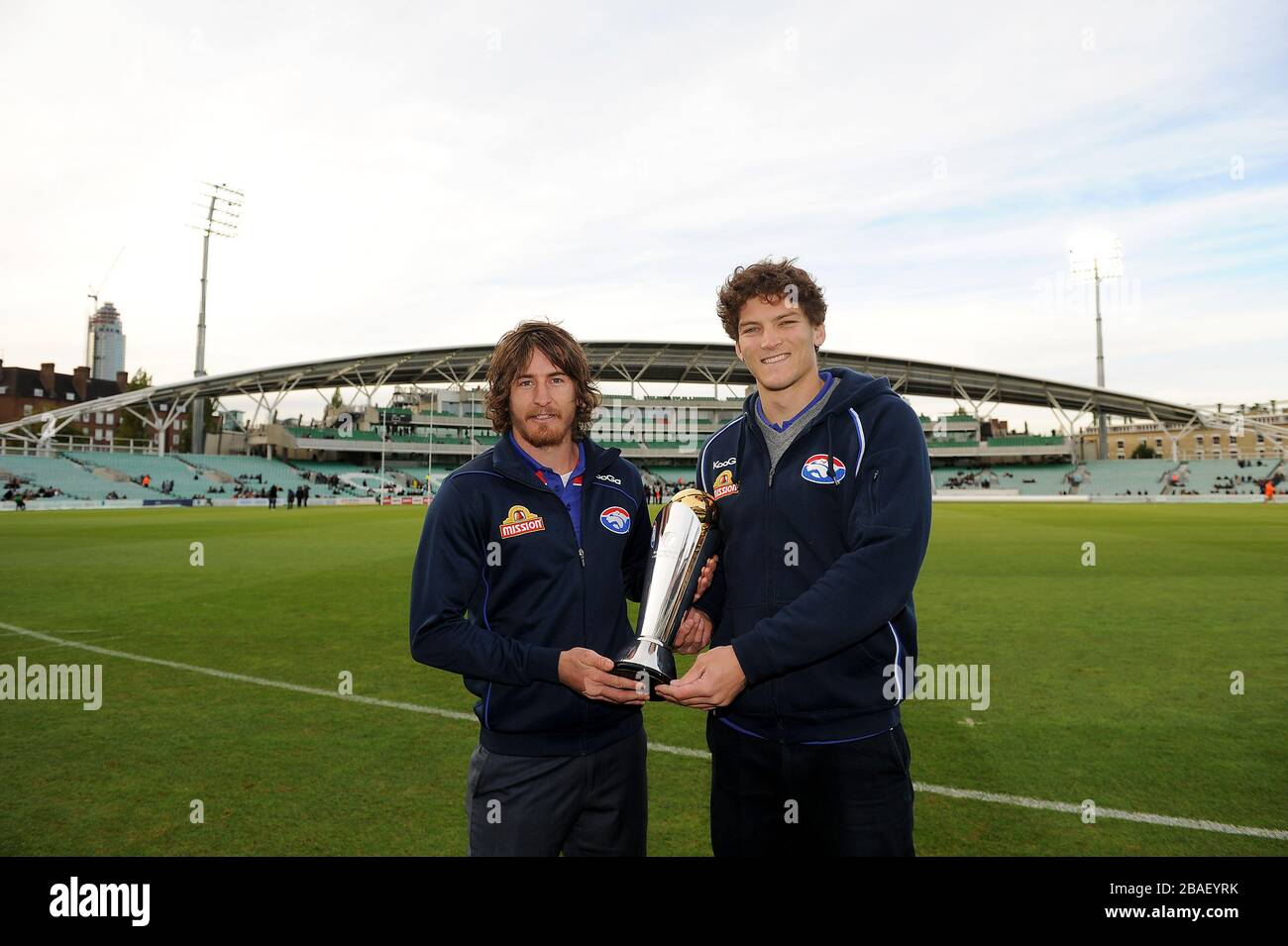 L-R: Western Bulldogs' Dylan Addison and William Minson with the ICC Trophy Stock Photo