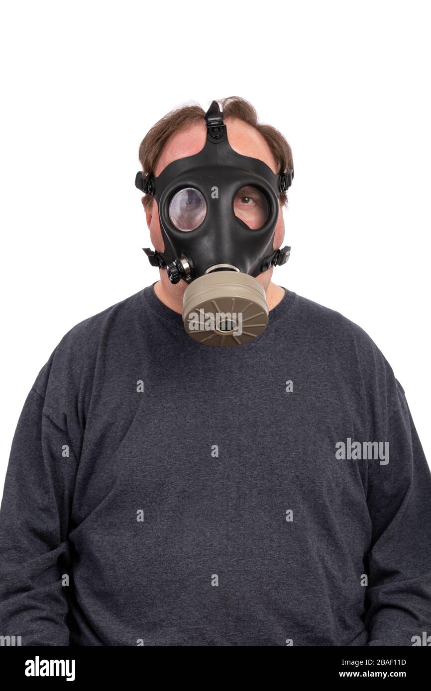 Arkesden, Essex . Man mowing the lawn wearing a gas mask as a precaution  against Saharan Dust pollution Stock Photo - Alamy