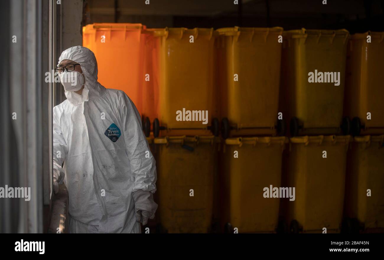 (200327) -- WUHAN, March 27, 2020 (Xinhua) -- Wang Peng checks if there is more medical waste to be disposed in Wuhan, central China's Hubei Province, March 26, 2020. Wang Peng, 35, has been working for the Wuhan Hanshi Environmental Engineering Company for 9 years, where he is responsible for the disposal and incineration of medical waste.Protection against infection is a major challenge that Wang and his coworkers face, as they work 12-hour shifts to cope with the surging workload during the COVID-19 outbreak. 'I like what I'm doing,' Wang said, 'I'm not only making money for my family, but Stock Photo