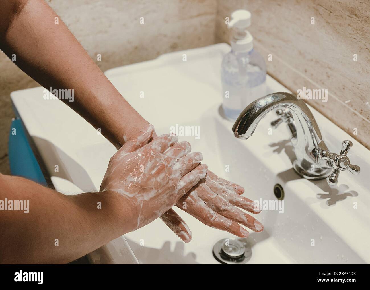 Corona virus travel prevention man showing hand hygiene washing hands