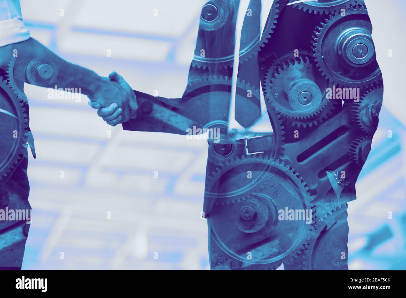 business industry, engineer businessman handshake overlay with machine gear Stock Photo