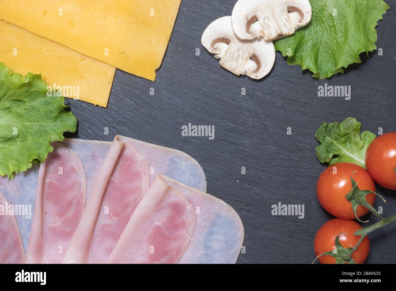 Fresh tasty hamburger ingredients with cheese and mushrooms Stock Photo
