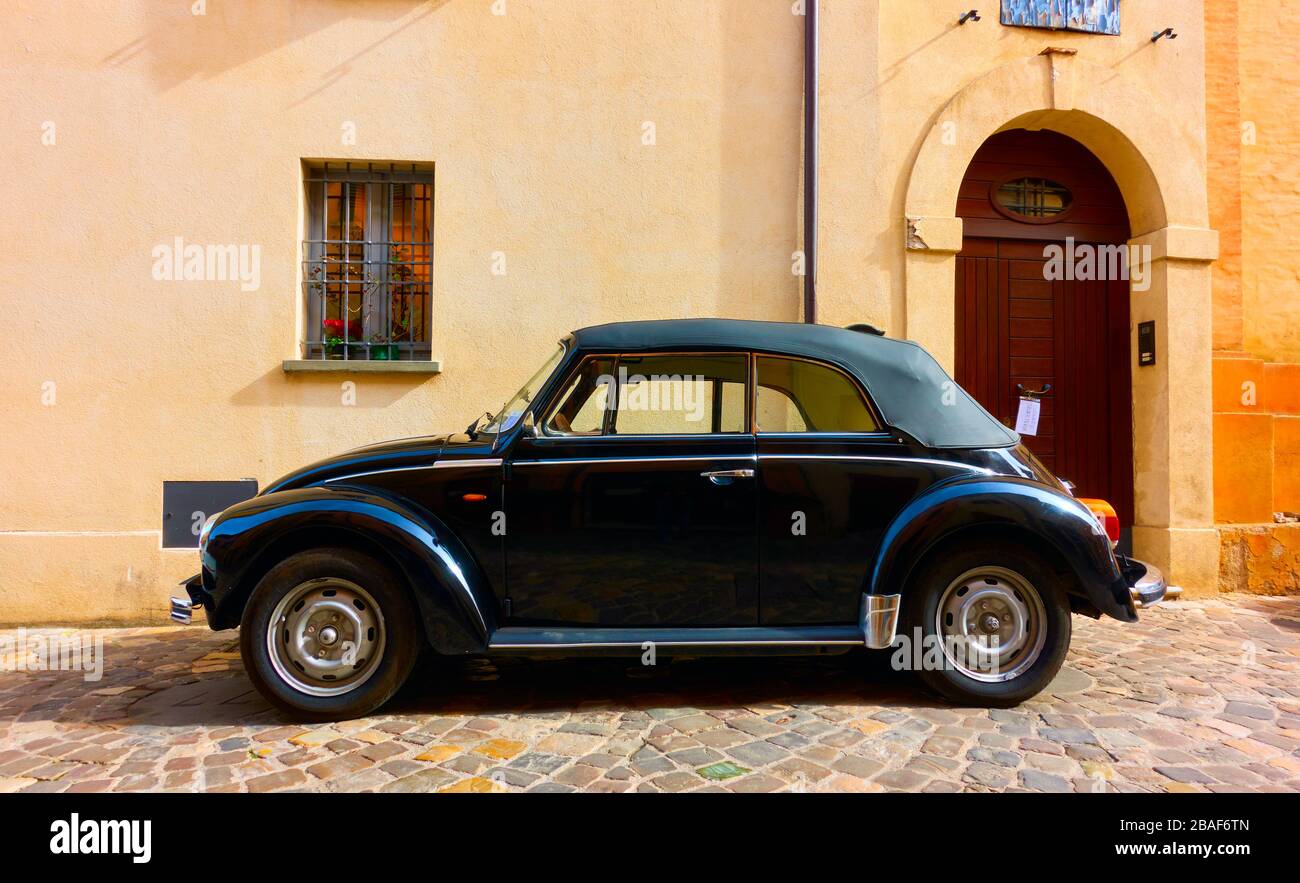 San Giovanni in Marignano, Italy - February 29, 2020:  Side view of black vintage car Volkswagen Beetle 1303 Cabriolet (1972—1980) parked in the stree Stock Photo