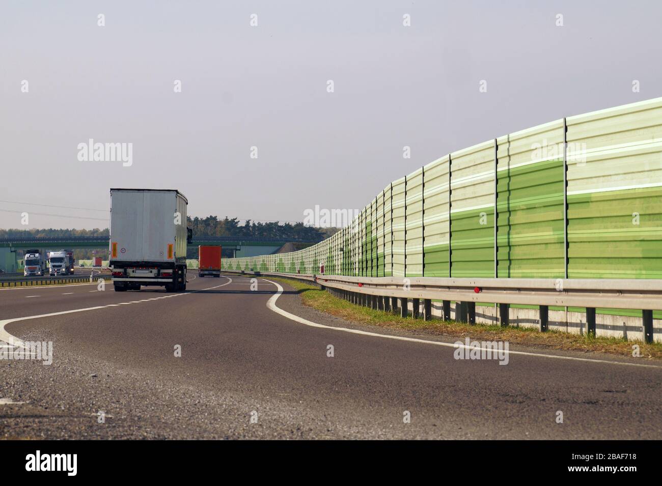 The road is protected against noise emission by noiseabsorbing barrier