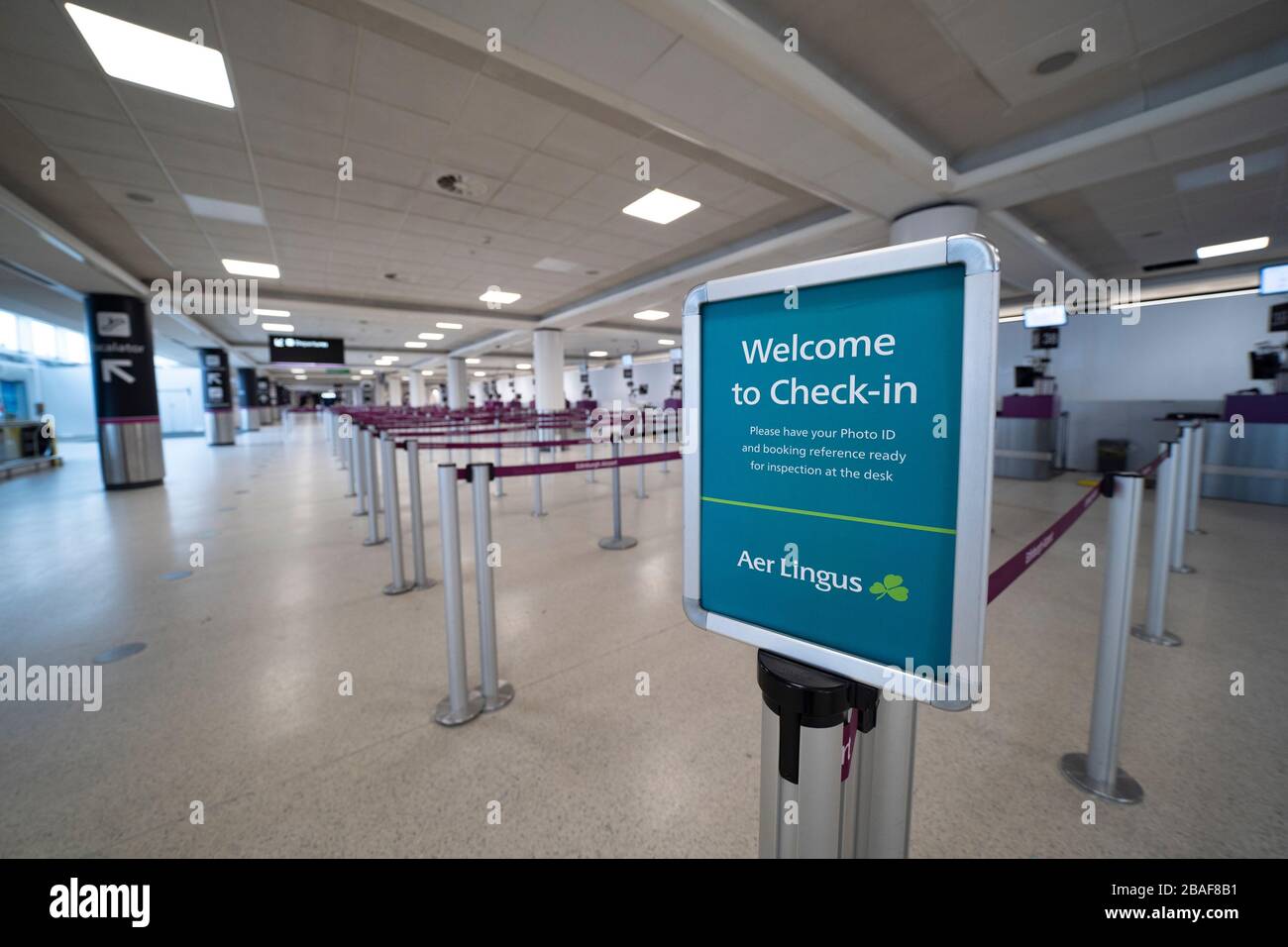 Edinburgh, Scotland, UK. 27 March, 2020. Interior views of a deserted Edinburgh Airport during the coronavirus pandemic. With very few flights during the current Covid-19 crisis passengers are scarce in the terminal building. Empty check in at Aer Lingus counter. Iain Masterton/Alamy Live News Stock Photo