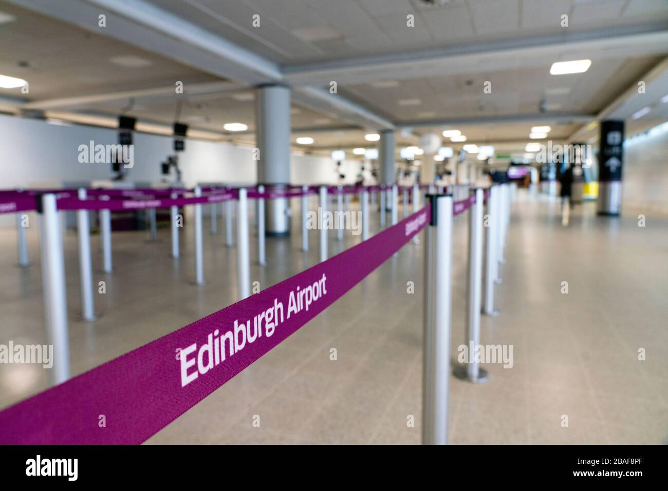 Edinburgh, Scotland, UK. 27 March, 2020. Interior views of a deserted Edinburgh Airport during the coronavirus pandemic. With very few flights during the current Covid-19 crisis passengers are scarce in the terminal building. Iain Masterton/Alamy Live News Stock Photo