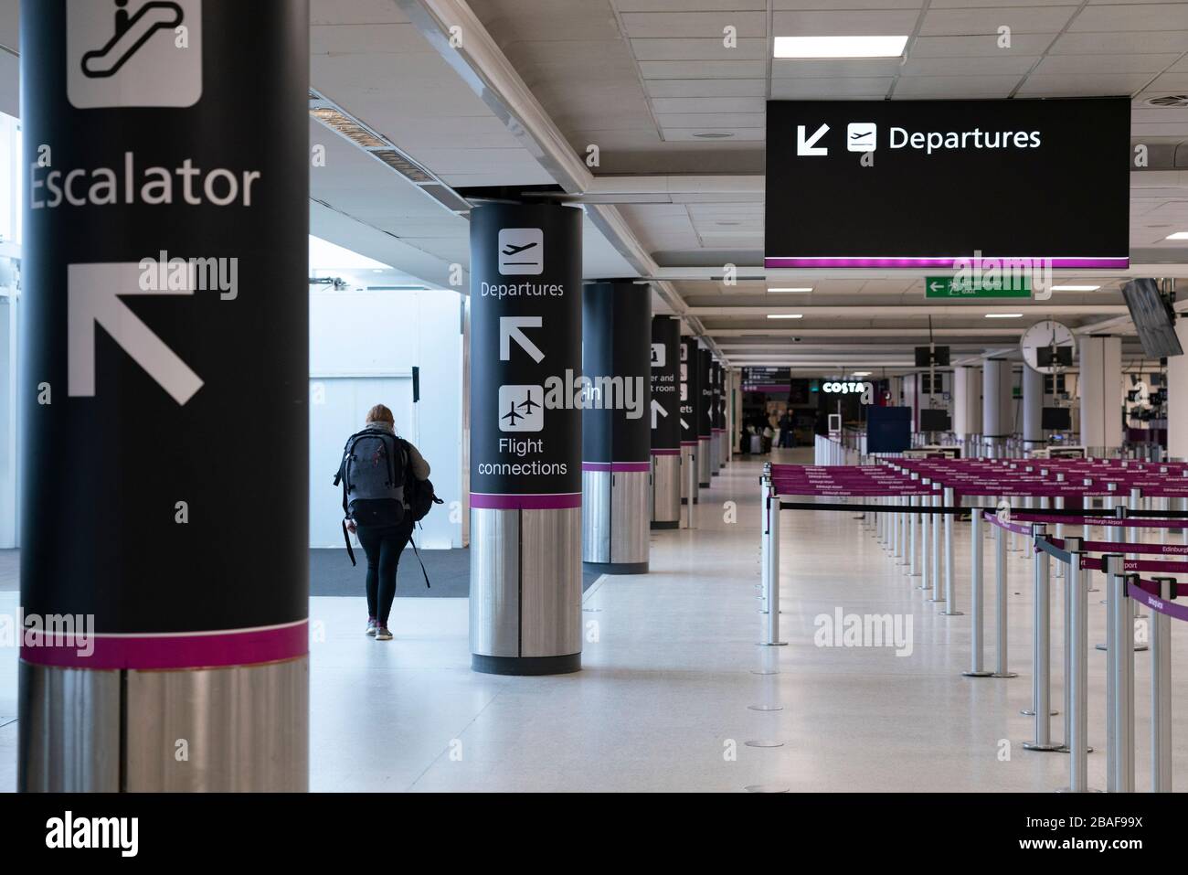 Edinburgh, Scotland, UK. 27 March, 2020. Interior views of a deserted Edinburgh Airport during the coronavirus pandemic. With very few flights during the current Covid-19 crisis passengers are scarce in the terminal building. Iain Masterton/Alamy Live News Stock Photo